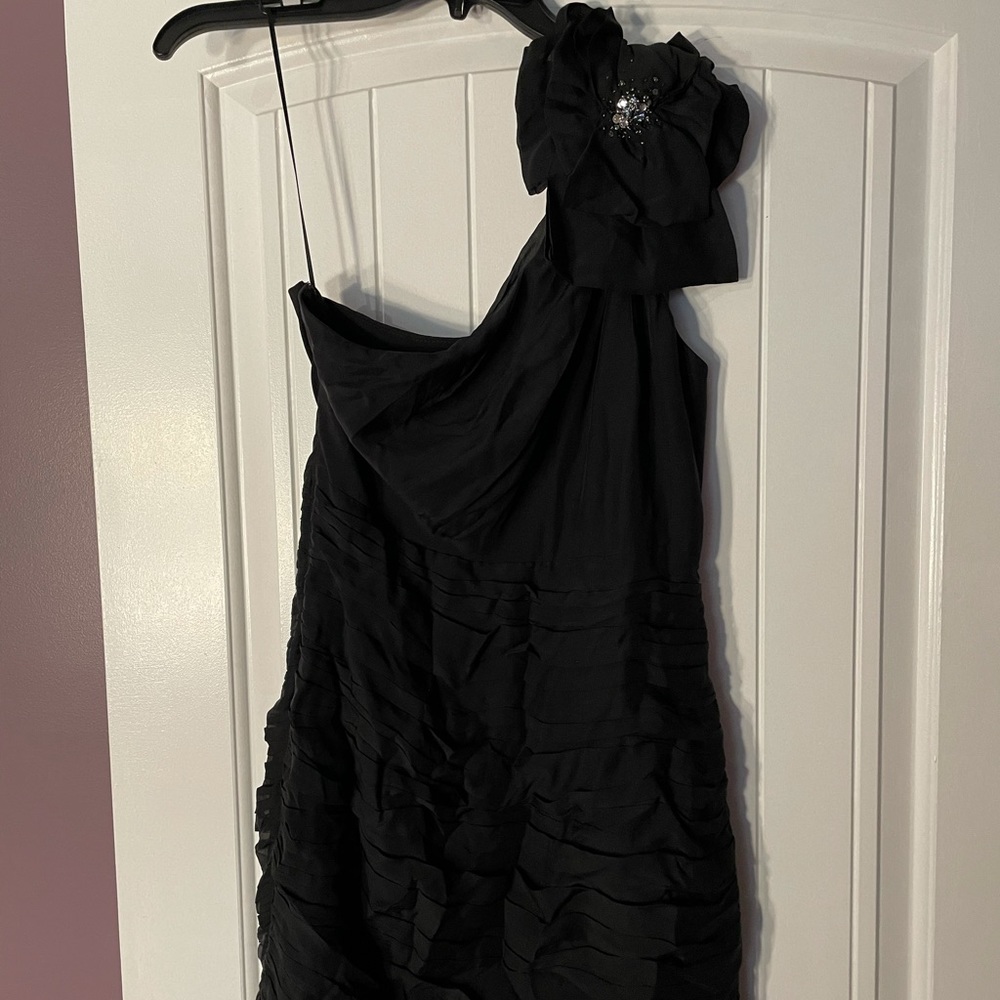 Black one shoulder cocktail dress w/ flower detail